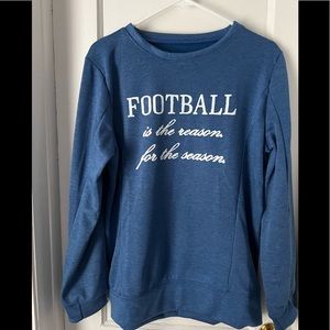 Women’s football sweatshirt. Marked size XL but fits more like a L.